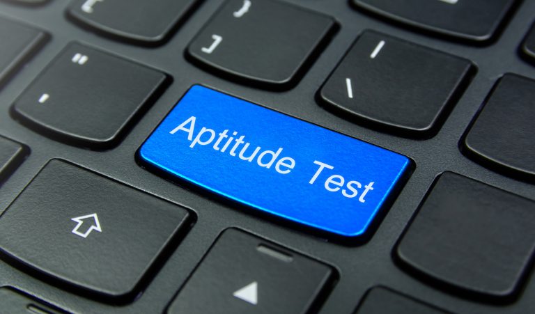 Business Concept: Close-up the Aptitude Test button on the keyboard and have Azure, Cyan, Blue, Sky color button isolate black keyboard